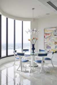 Contemporary dining room with window wall.